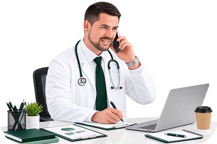 Physician on a phone call reviewing information on a laptop